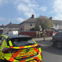 Emergency personnel at a fire in a semi-detached house in Bootle