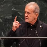 Iran’s President Masoud Pezeshkian gestures while speaking