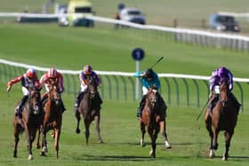 Libertango (left) challenging at Newmarket