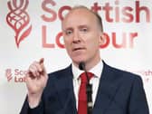 Michael Marra gesturing as he makes a speech