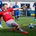 Whitchurch Alport goalscorer Alfie Gregory lunges in