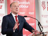 Michael Marra gesturing as he makes a speech