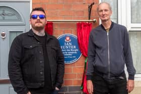 Ian Hunter's grandson, Jay, and Councillor Duncan Kerr next to the newly unveiled plaque 