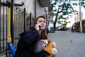 A woman reacts after a Russian drone strike on central Kyiv, Ukraine