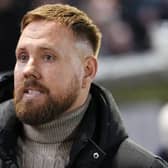Rob Elliot looks on