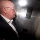 Peter Murrell in the back of a prison van