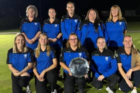 Sir John Bayley B’s County Cup winning squad with captain Jodie Simmonds holding the salver