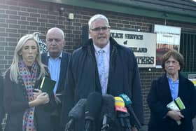 DUP leader Gavin Robinson (centre right) speaks to media at Police Service of Northern Ireland headquarters in east Belfast after meeting Chief Constable Jon Boutcher