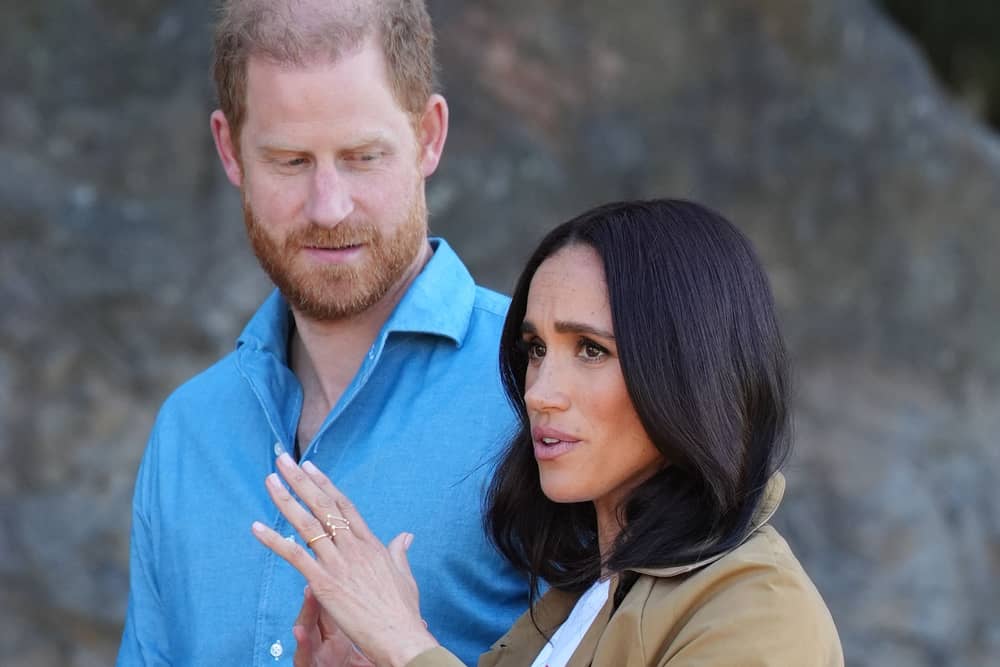 Duke and Duchess of Sussex look serious