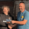 Andrew Bevan, Hundred House Show chairman presenting a cheque for £3,000 to Jess on behalf of DPJ Foundation 