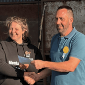 Andrew Bevan, Hundred House Show chairman presenting a cheque for £3,000 to Jess on behalf of DPJ Foundation 