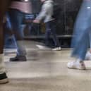 People walking in a busy indoor public space