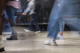 People walking in a busy indoor public space
