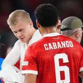 Erling Haaland gives his shirt to Ben Cabango at the end of the Wales v Norway Nations League tie