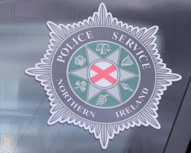 PSNI badge in police car window