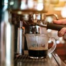 Coffee being prepared in a coffee shop