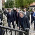 Breandan Mac Cionnaith (Brendan McKenna) (front) of the Garvaghy Road Residents’ Coalition arrives at Laganside Courts in Belfast