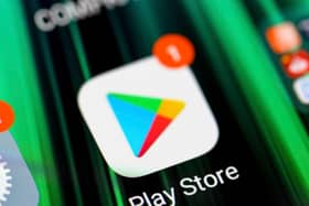 The Play Store app icon on smartphone screen