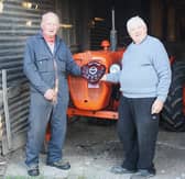 Presentation to Keith Williams of the Owain Meredith Micah Shield for the best restored vintage tractor by judge John Bates