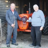 Presentation to Keith Williams of the Owain Meredith Micah Shield for the best restored vintage tractor by judge John Bates