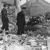 Firefighters survey the rubble of Ironbridge Metal Company after the 1950 blast.