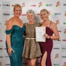 Ellie (l) and Laura (r) collecting their award from Maxine Laceby 