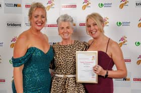 Ellie (l) and Laura (r) collecting their award from Maxine Laceby 