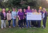 Members of the Penybont and District Charity Committee presenting the donation to Tori Williams of Marie Curie 