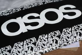 An Asos delivery package lying on the floor along with letters received in the post