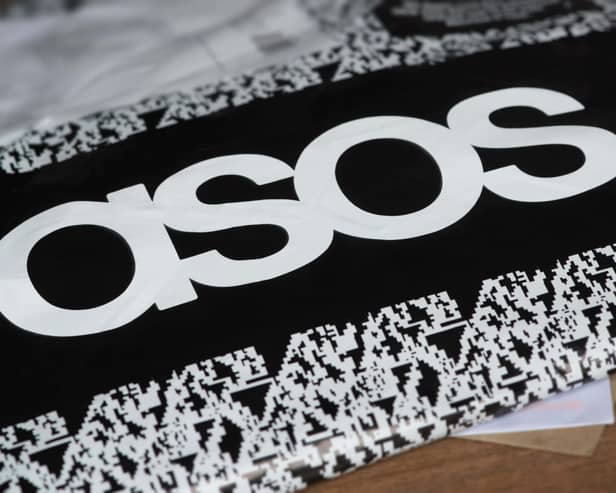 An Asos delivery package lying on the floor along with letters received in the post