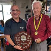 Shield of success for Bowring A and skipper Mark Doodson, seen with league president Brian Williams
