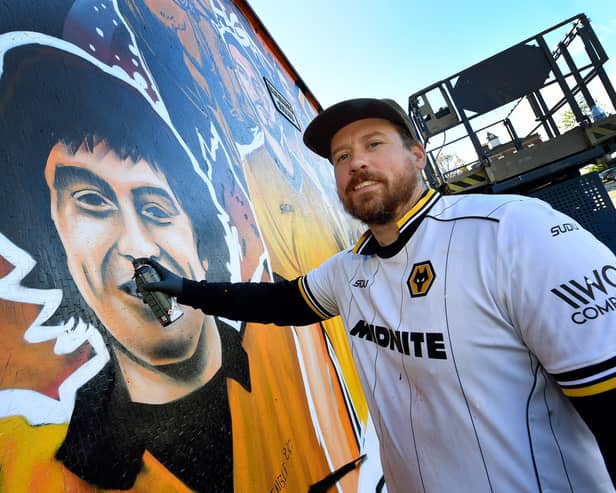 Artist Joe Miles has repaired his incredible Wolves mural after it was vandalised.

