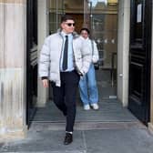 Ilia Belov and Nadjedzha Belova leaving a court building