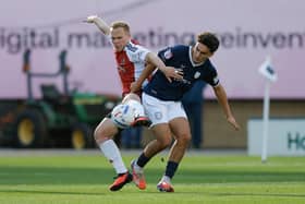 Kian McMahon-Brown of Shrewsbury Town and Anthony Scully of Exeter City