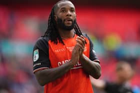 Kasey Palmer applauds the Luton fans