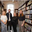 Bernadette McGill, Andrew Stanford, Gilly Campbell and Padraig Regan, standing in a library