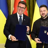 Volodymyr Zelensky and Andy Burnham pose after signing a partnership deal on AI following a bilateral meeting in Kyiv