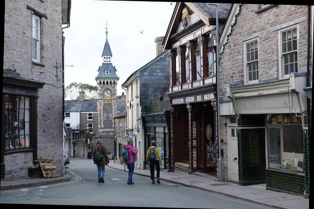Hay's town clock at the end of the street featuring Richard Booth's The King of Hay Bookshop