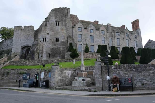 The imposing Hay Castle looking over the town and its war memorial