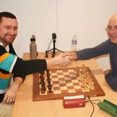 A handshake before battle - Pym, left, and Glyn Pugh get the playoff under way.