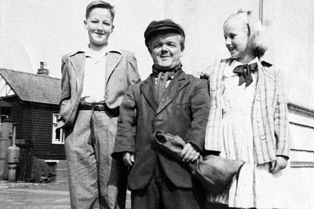 Billy Lloyd in front of Dawley’s Captain Webb Memorial with two unidentified children.