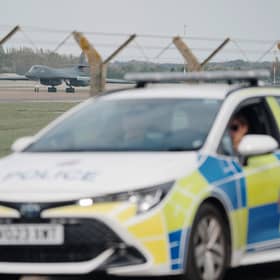 Police patrol the perimeter at RAF Fairford in Gloucestershire