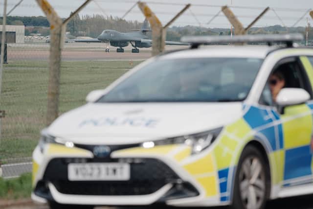 Police patrol the perimeter at RAF Fairford in Gloucestershire