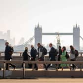 Commuters walking across London Bridge