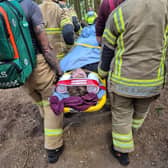 The young casualty being carried to safety from Bucknell woods.