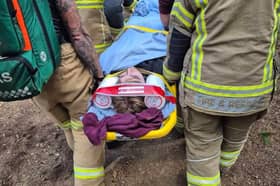 The young casualty being carried to safety from Bucknell woods.