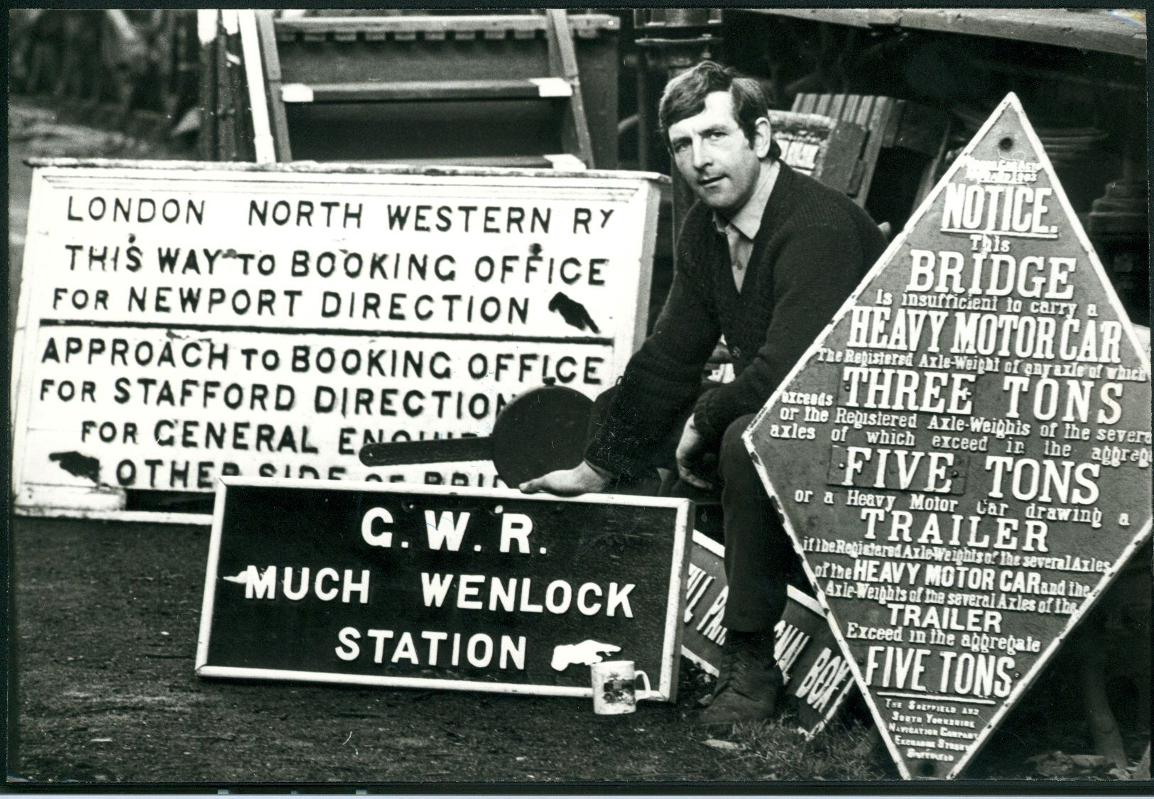 Nigel Hadlow, who was assistant general manager of the Chasewater Light Railway, near Cannock, was sprucing up some old signs ready for the new season when this picture was taken in February, 1978. Old railway signs continue to be in high demand from collectors.  