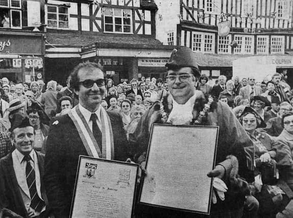 PICTURE FROM THE ARCHIVE: The Mayor of the French town of Thiers, Mr Maurice Adevah-Pœuf (left), and Bridgnorth Mayor Councillor Mike McCarthy pose proudly in Bridgnorth High Street on October 1, 1978. The pair held up the official scrolls commemorating the civic ceremony that formally united Bridgnorth and Thiers as twin towns. Were you in the High Street crowd to watch this historic moment in Bridgnorth's history?
