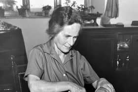 PICTURE FROM THE ARCHIVE: Dora Mayall slices a loaf of homemade bread at Lea Hall in Harmer Hill, captured in a photograph published on July 23, 1960. Married to local farmer Sam Mayall, Dora baked her own loaves using wheat grown right on their farm—a true picture of self-sufficiency and natural living long before it became a modern trend. Do you or your family bake your own bread using traditional methods, or does this slice of 1960s farm life bring back fond memories?