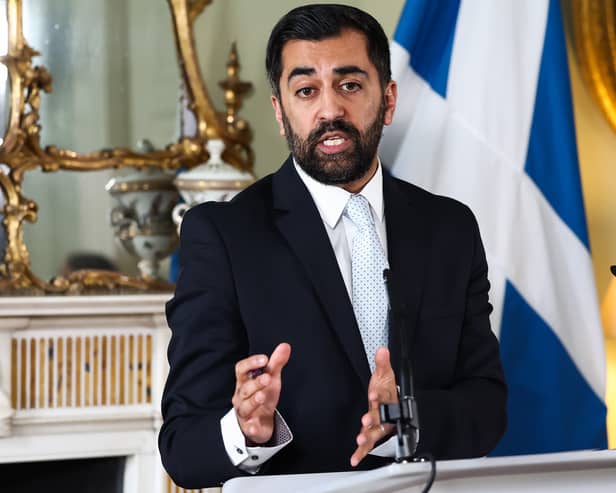 Humza Yousaf making a point as he speaks to the media